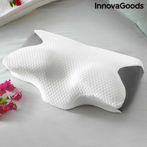 White and grey contoured foam pillow with a textured honeycomb fabric cover on a bed. InnovaGoods logo in the corner.